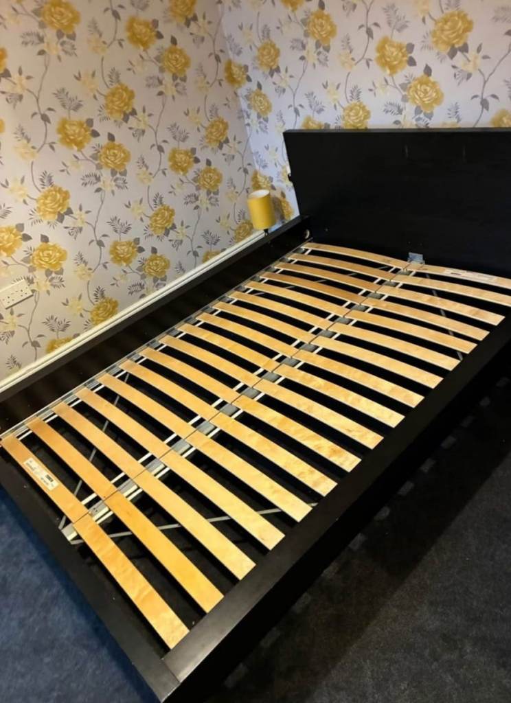 Black double wooden bed frame in good condition with mattress if needed 