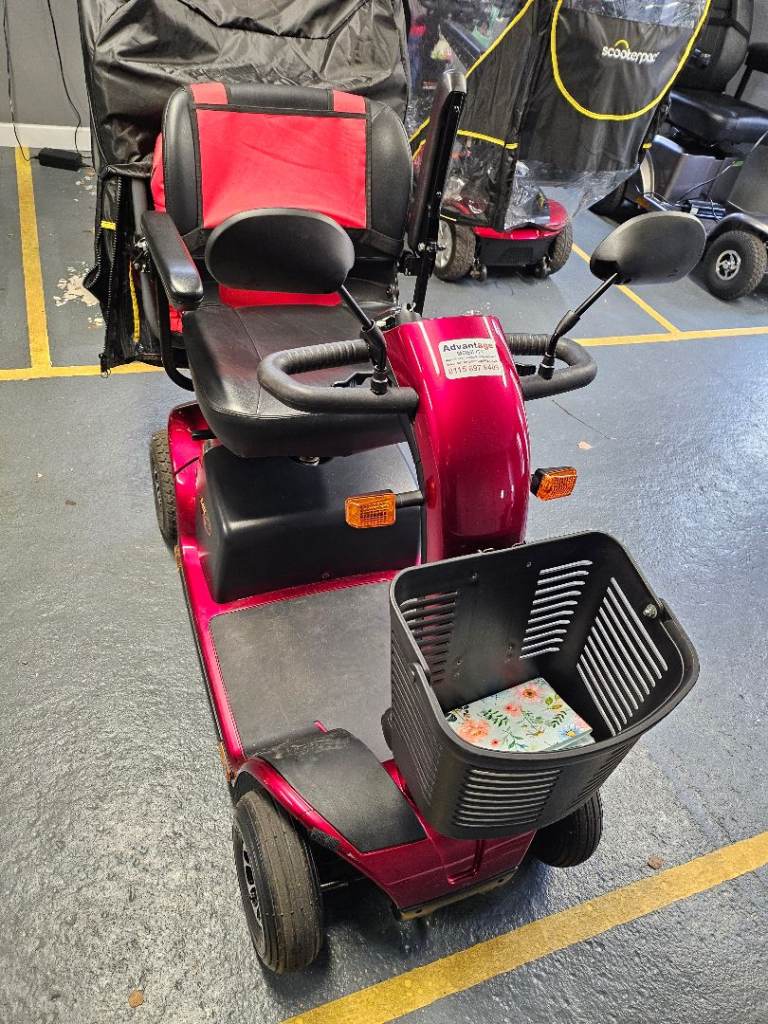 pride colt plus mobility scooter with scooterpac canopy