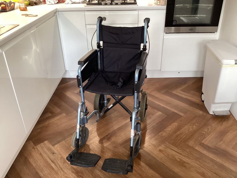 Comfortable Wheelchair  £50 ideal for a small person. 2 crutches 