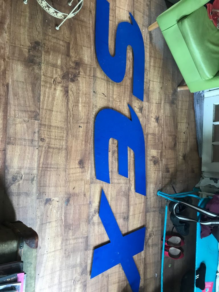 “SEX” large blue signage. Separate letters. 20” X 30”. 