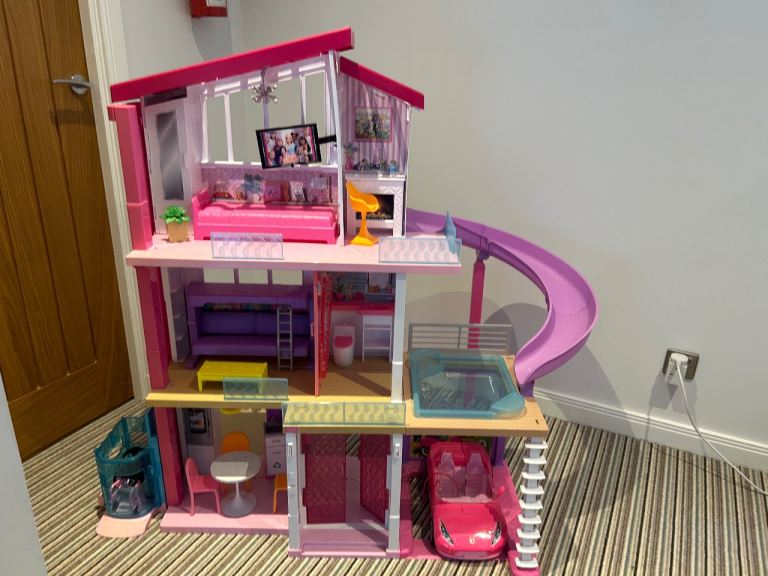Barbie dreamhouse with accessories and car and wheelchair