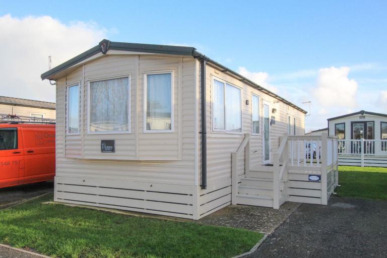 Victory Vision 2014 static caravan sited at Pevensey Bay, E Sussex. Decking