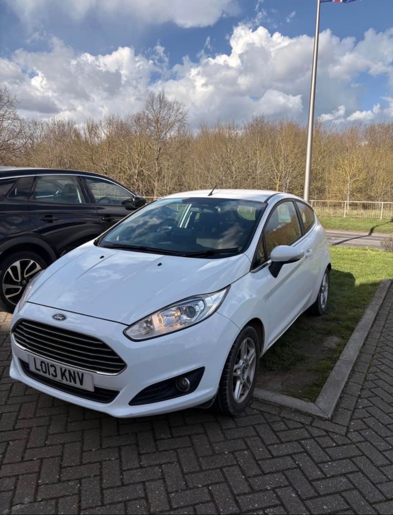 White Ford Fiesta 13 plate. 
