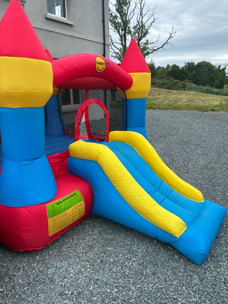 HappyHop Bouncy Castle with Slide and Blower – Good Condition