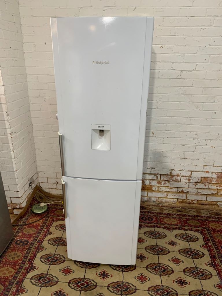 Hotpoint fridge freezer in good working order, with a built-in water dispenser.