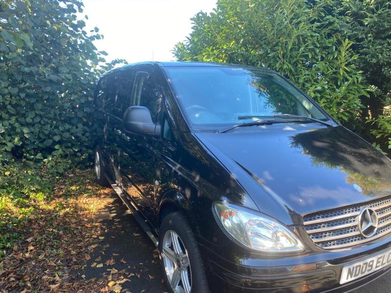 Black Mercedes Benz van 