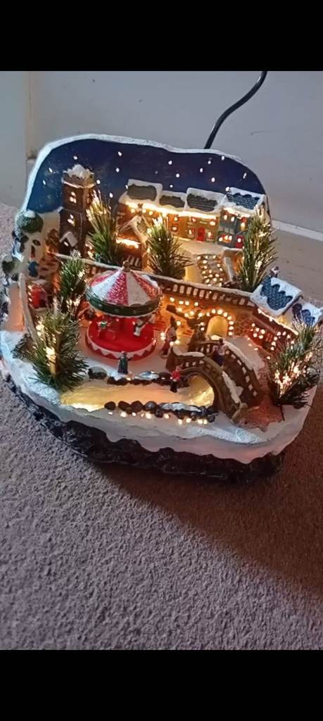 Light-Up Christmas Village Decoration with Carousel – Good Condition