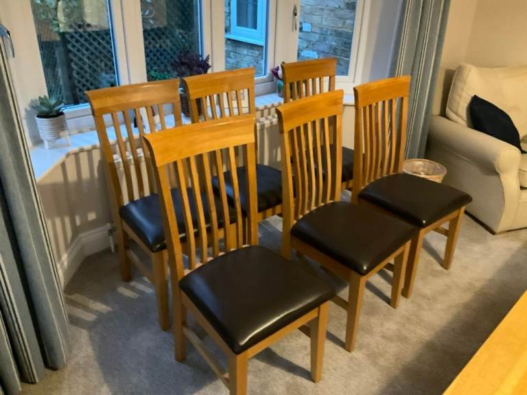 Six Solid Oak Dining Room Chairs and Two Solid Oak Carver Dining Chairs. 
