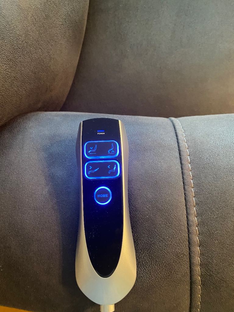 Electric rise and fall armchair in dark grey. 