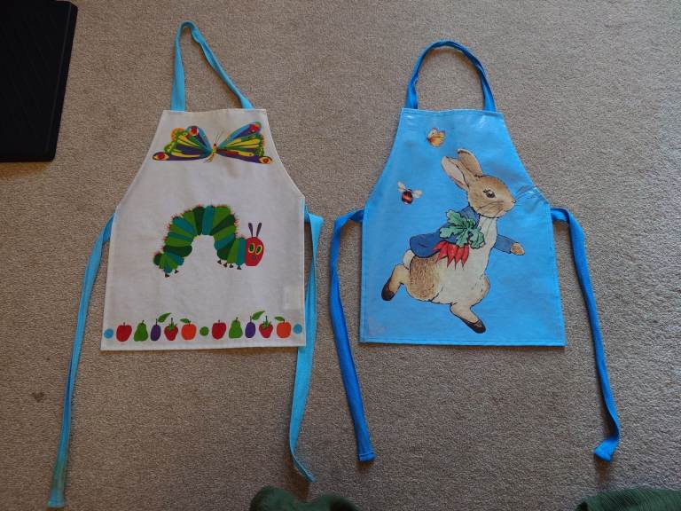 2 Kids' Baking Aprons - Hungry Caterpillar & Peter Rabbit - 50p each