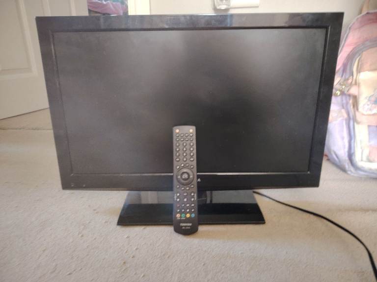 Black Flat Screen TV with Remote – Good Condition