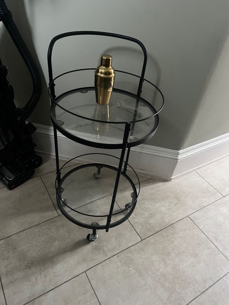 Stylish black and glass drinks trolley 