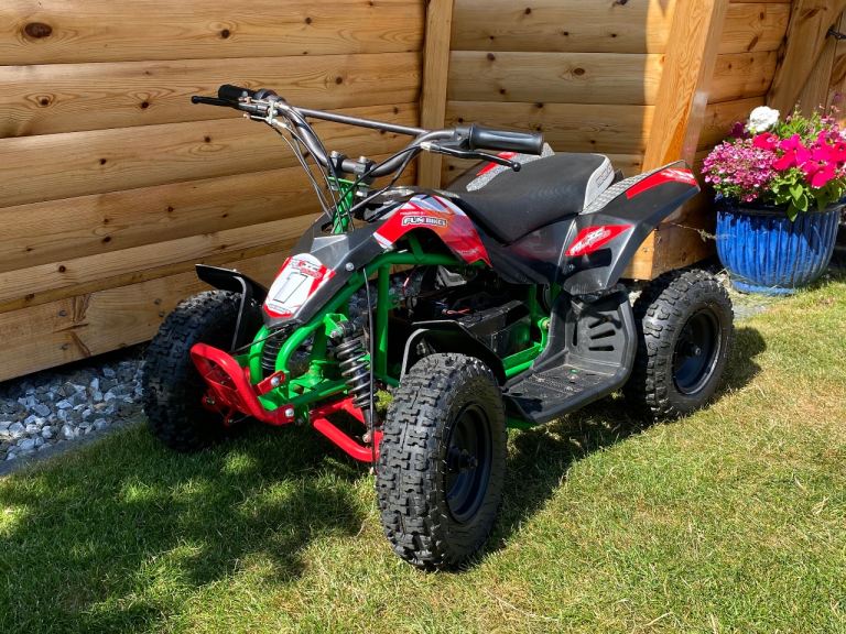 Kids 24v Electric Quad Bike – Red, Green and Black, Good Condition