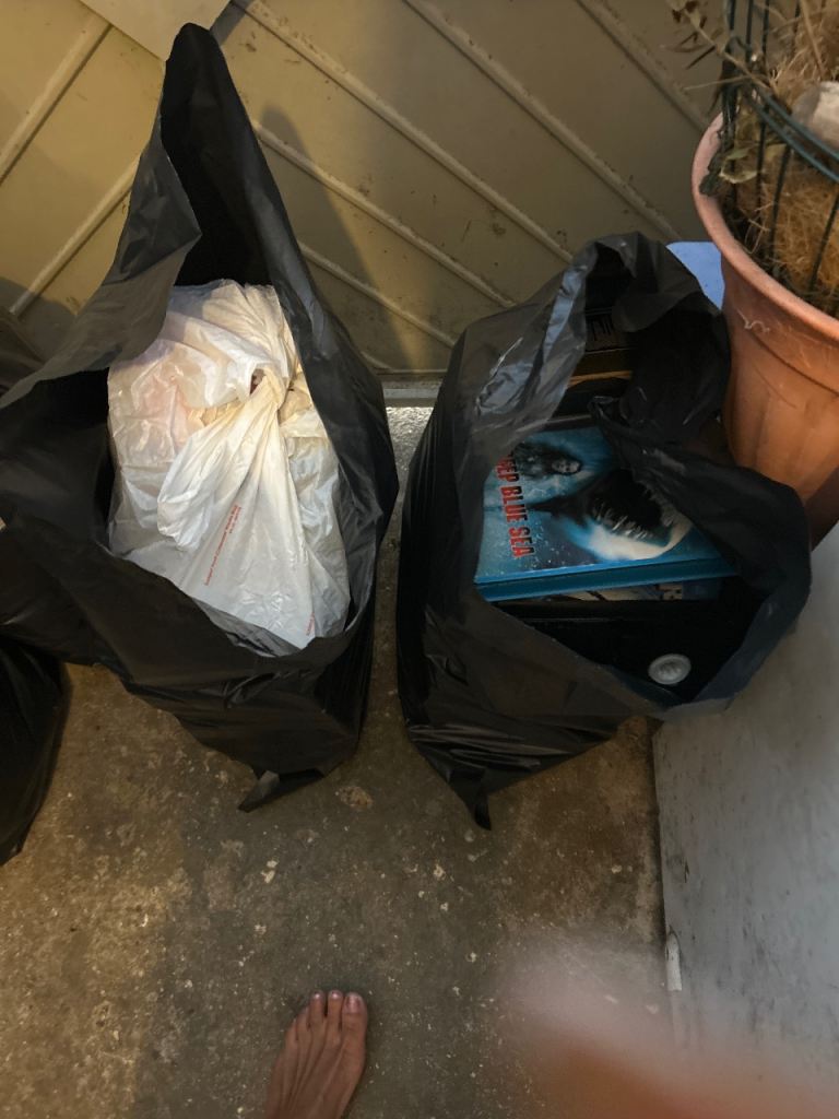 2 Blacks full of DVD’s Videos and CD’s