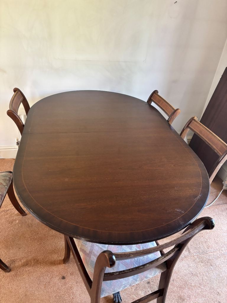 Dark wood table and chairs. 