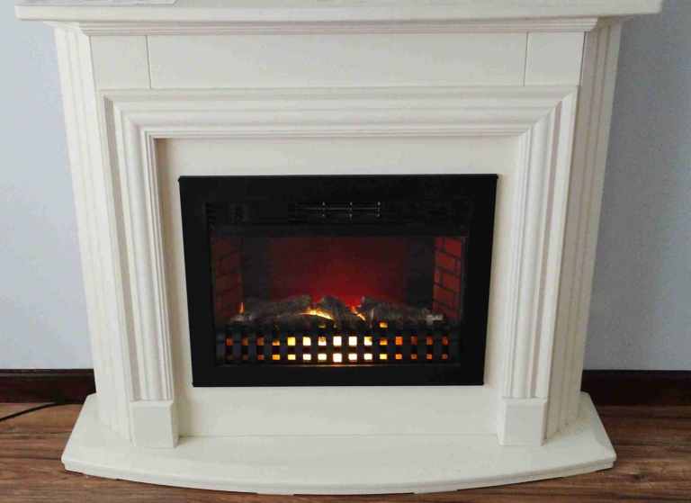 Electric Fire and Fireplace in good condition