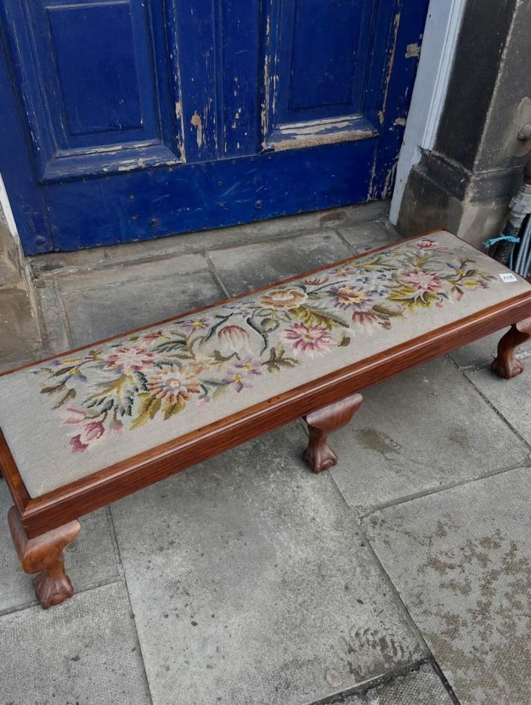 Antique Mahogany Footstool , with 6 ball and claw feet . Very good quality . Must be seen