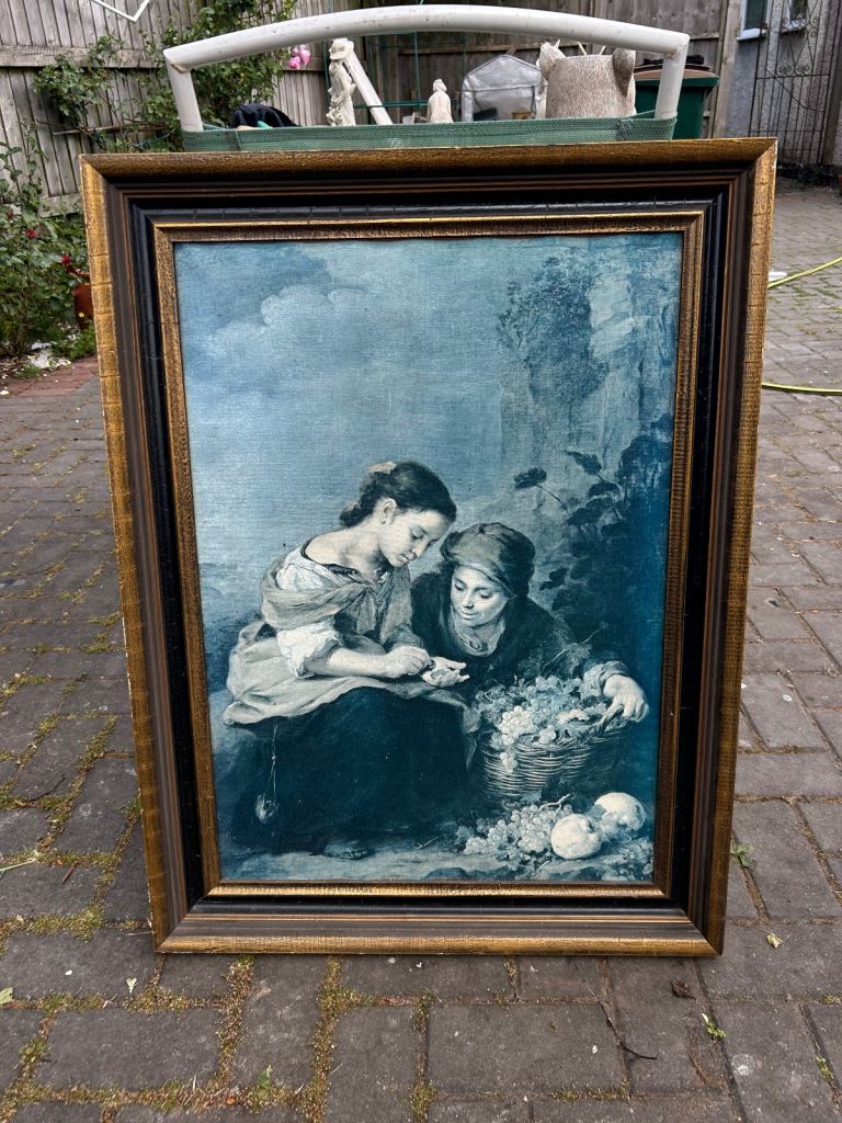 Large framed canvas print of a girl selling fruit