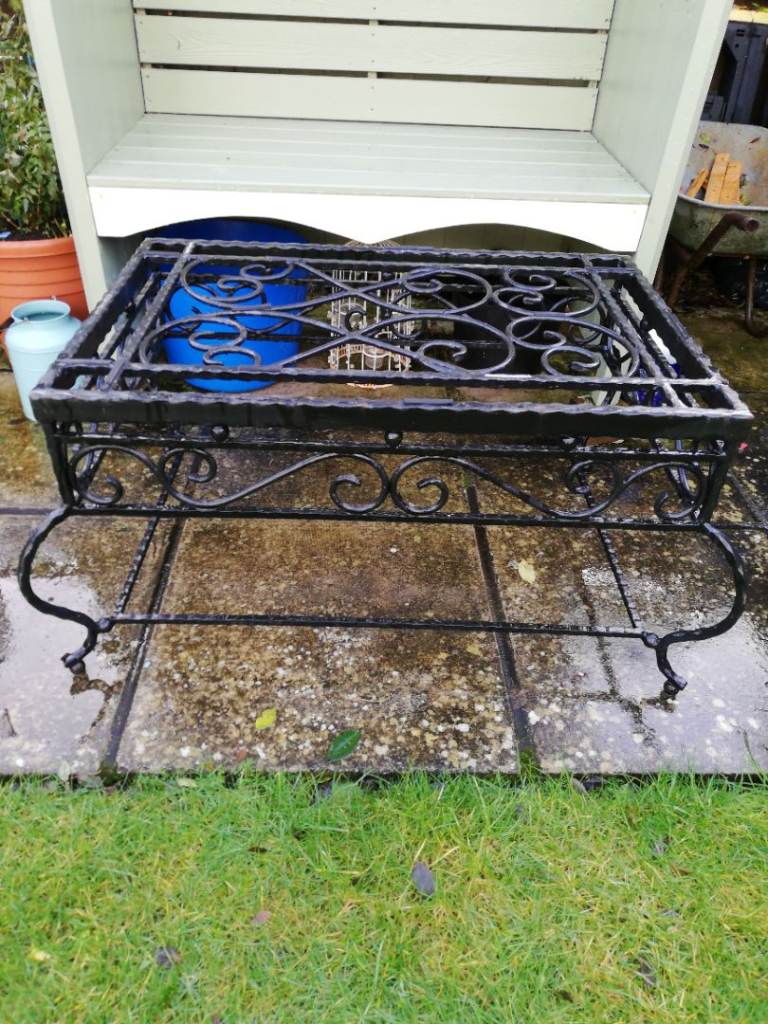 Lovely wrought iron coffee table for patio also conservatory. 