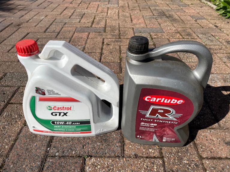 Castrol GTX 10W-40, 4 litre unopened, plus Carlube 5W-40 1 litre motor oil  opened.