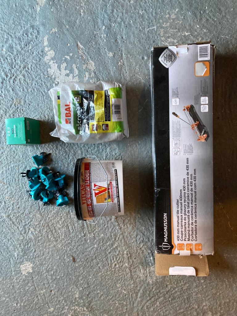 Tile cutter; left over adhesive and grout etc