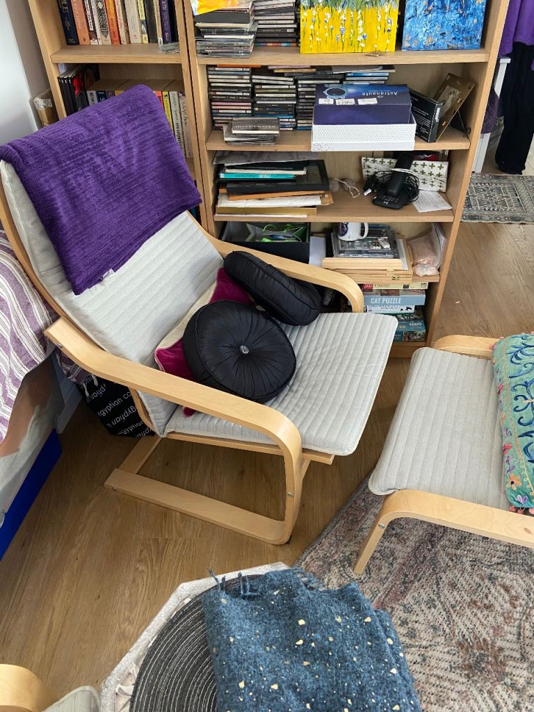 Two chairs with footstools