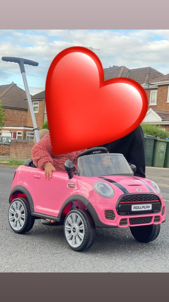 This is a Rollplay Mini Cooper Play Push Car with Parental Handle