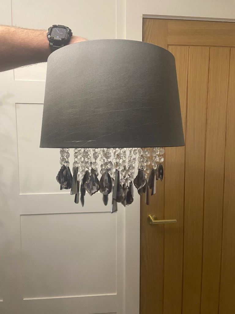 Grey ceiling or lamp shade with grey hanging crystals 