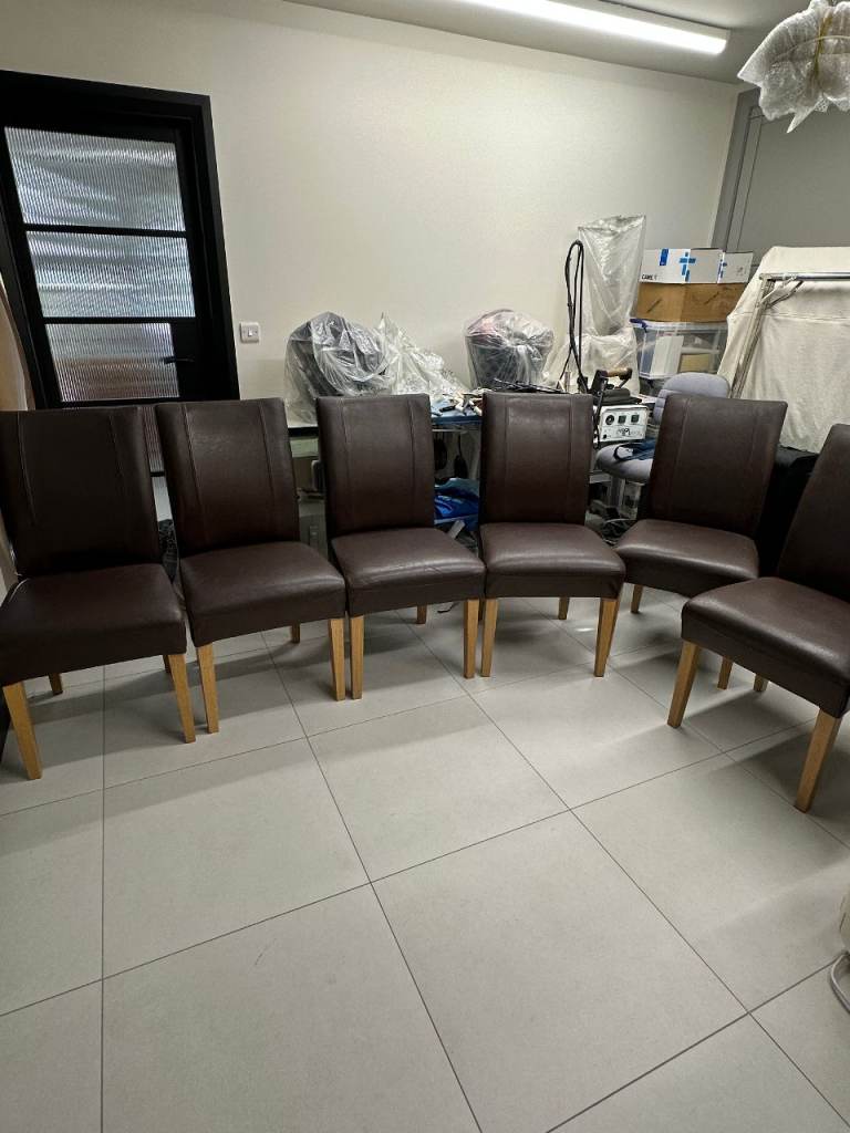 Set of six brown leather dining chairs