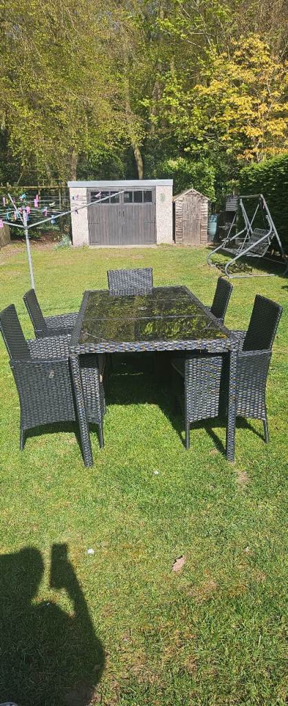 Black rattan dining table and 5 chairs