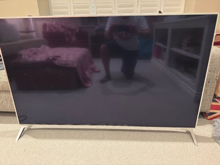 Large Flat Screen TV with Silver Stand – Good Condition