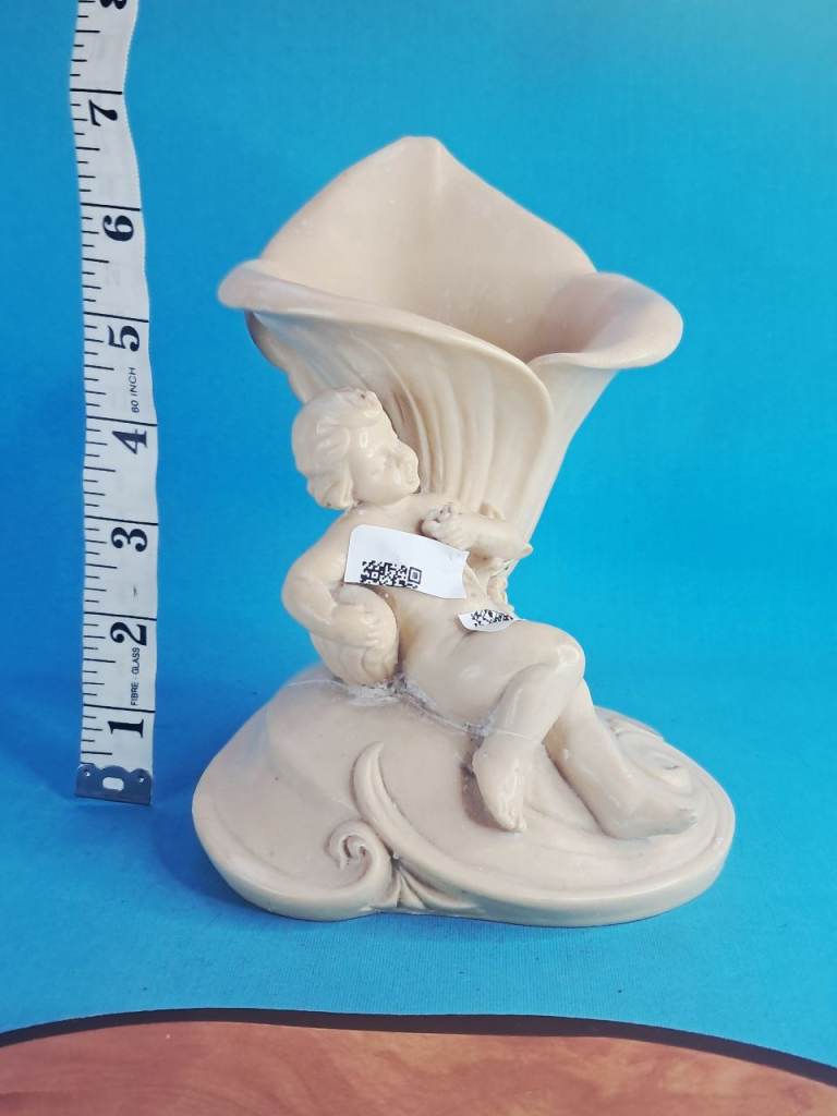 This is a  Large vintage ceramic cherub and cornucopia vase. or planter. As seen.. 