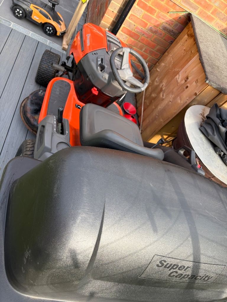 Sit on lawn mower tractor . 