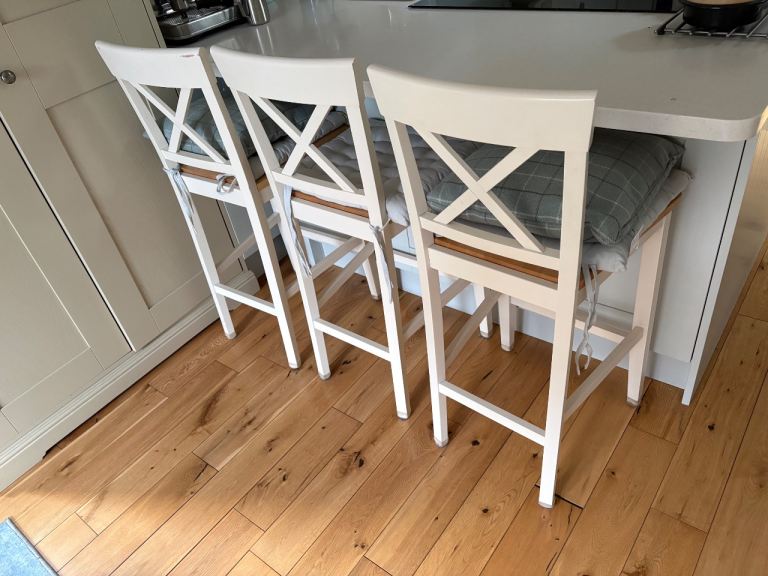 Three wooden kitchen stools