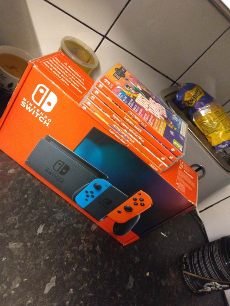 Nintendo Switch Console with Games – Good Condition