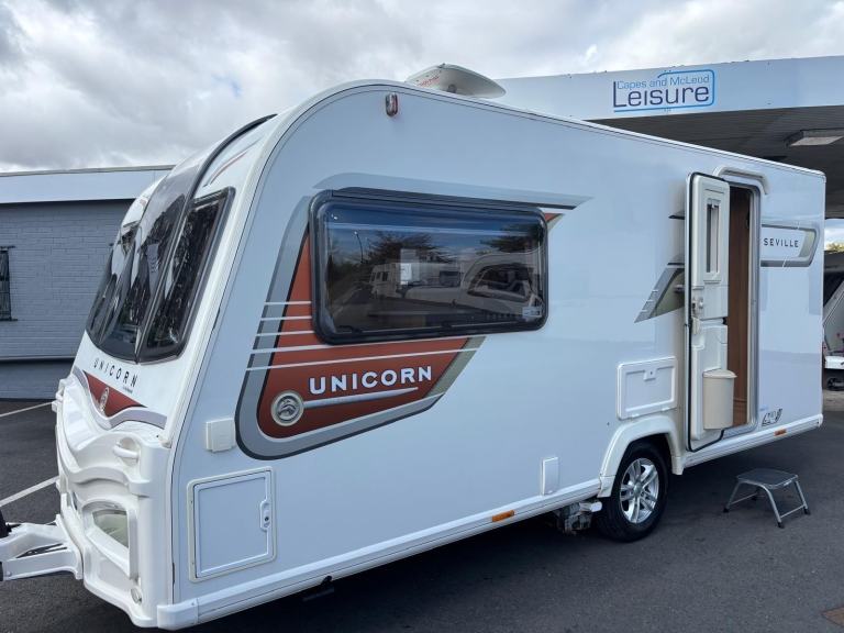 2013 BAILEY UNICORN SEVILLE, LUXURY 2 BERTH CARAVAN WITH REAR WASHROOM.