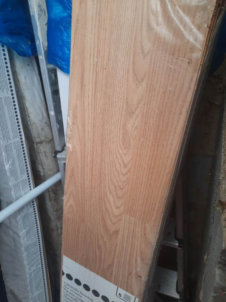 Laminate flooring for salex4. Brand new brown still in individual box