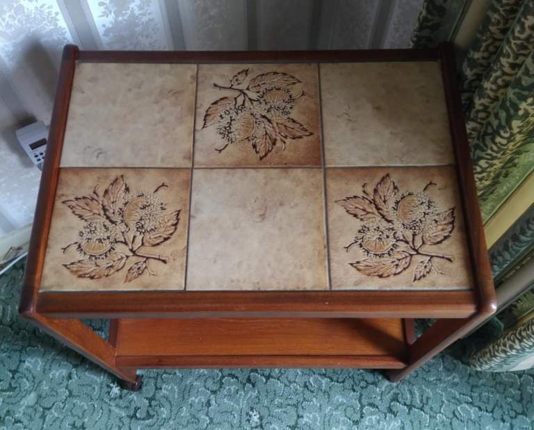 wooden trolley on wheels with mosaic top