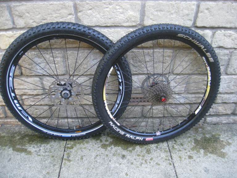 26 inch bike wheels / rear - sunringle ryde xmb / front- shimano mt35 ice tech rotor  + extra tyre 