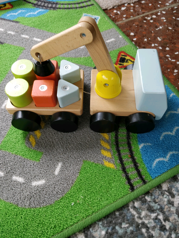 IKEA wooden towing truck with magnetic lifter.