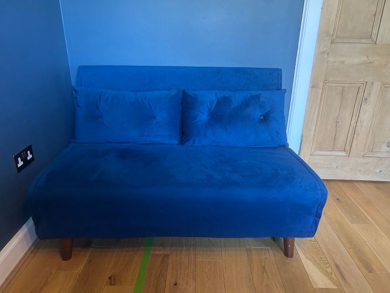 Blue velvet sofa bed