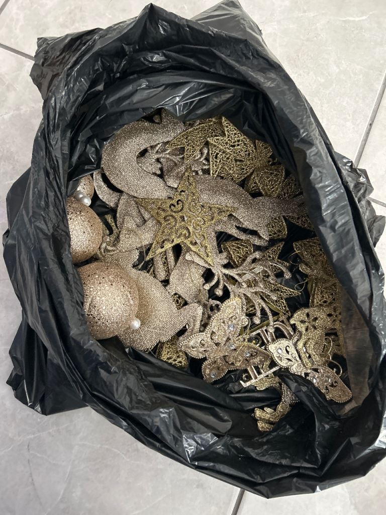 Bag full of gold Xmas tree decorations 