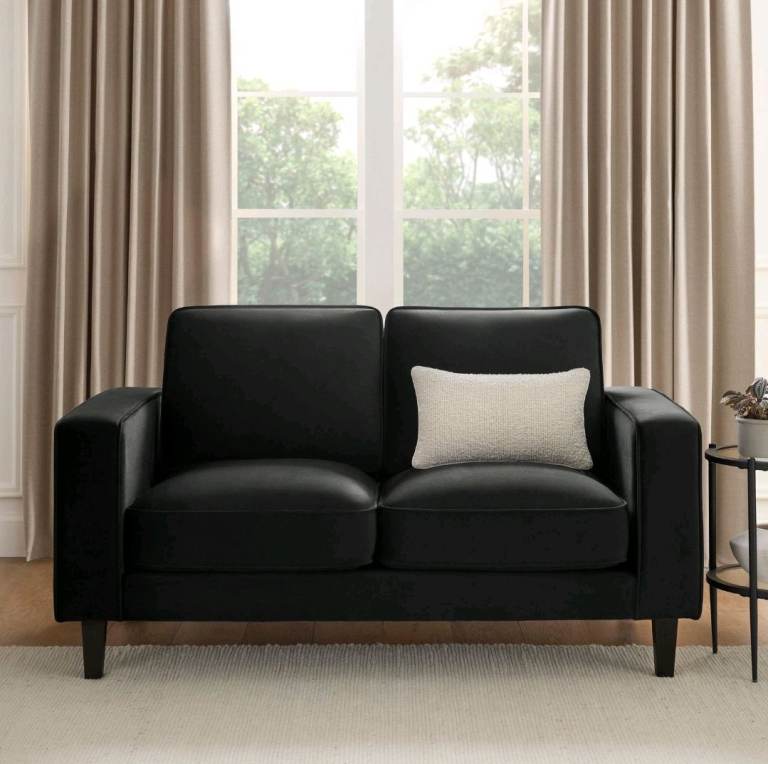 The Dusk Soho Ink Velvet 2 Seater Sofa is a luxurious and stylish addition to any living room.