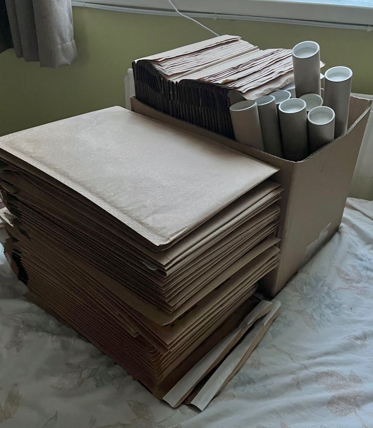 Large Quantity of Bubble Mailers and Cardboard Postal Tubes