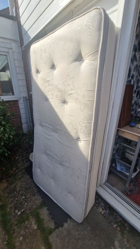 A nearly new firm single mattress for immediate sale