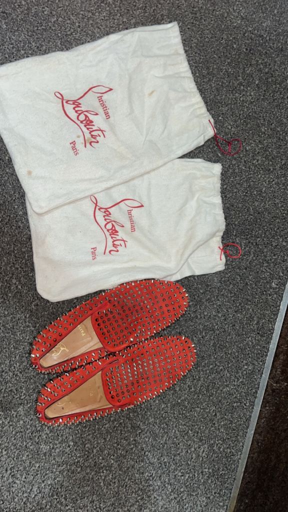 Christian Louboutin Dandelion Spikes loafers in red suede.