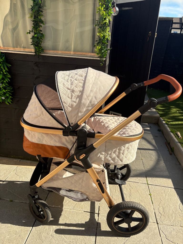 Cream and gold pram 