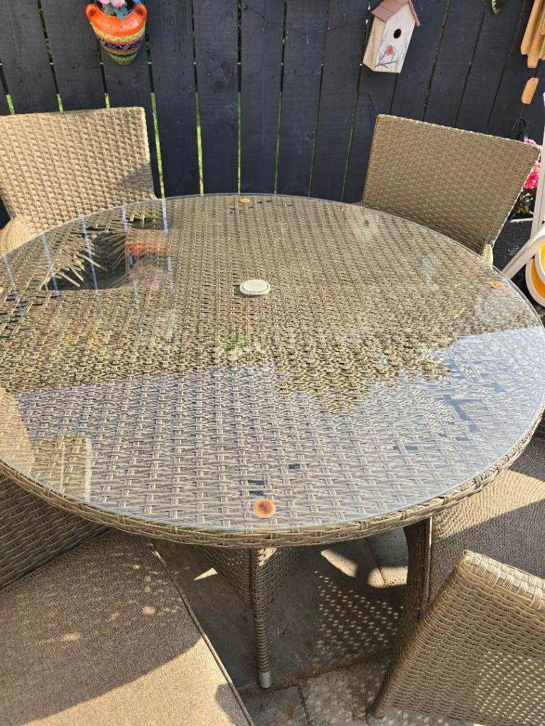 Ratten table and  4 chairs with cushions