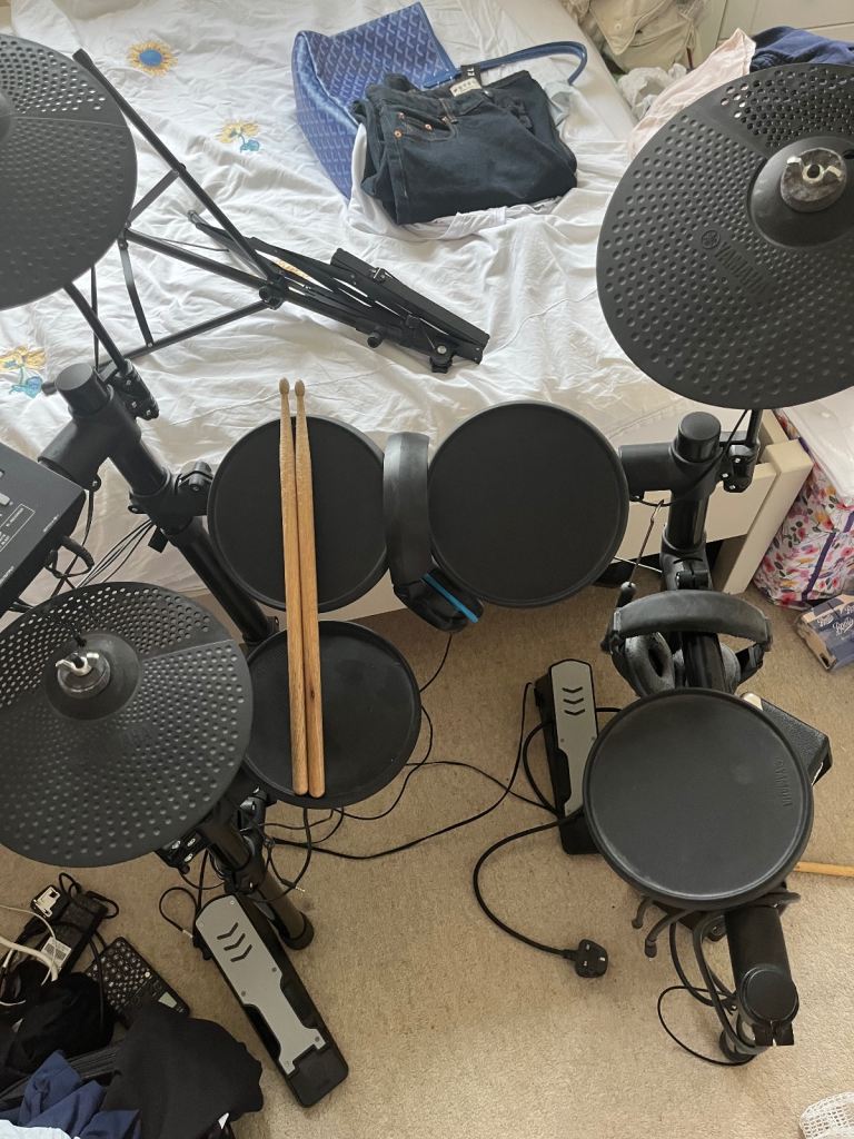Yamaha Electric Drum set with Fender Amp and drumsticks