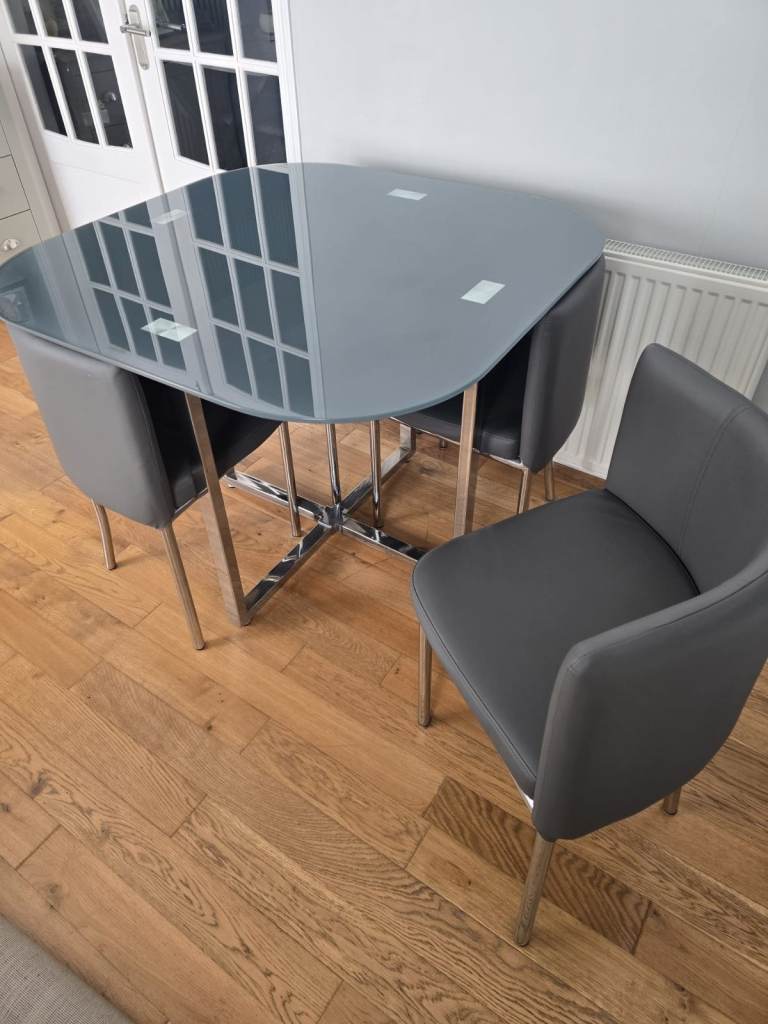 Glass table and 4 chairs chrome legs